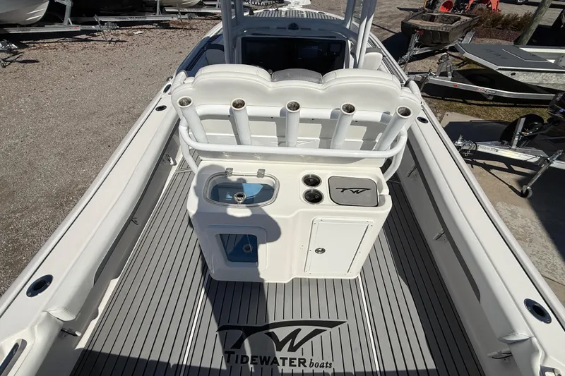 Slide: The Image of 2019 Tidewater 2700 Carolina Bay boat interior with rod holders and storage compartments. - 17
