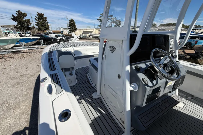 Slide: The Image of 2019 Tidewater 2700 Carolina Bay boat interior with steering console and seating. - 27