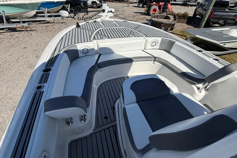 Slide: The Image of 2019 Tidewater 2700 Carolina Bay boat interior with seating and deck view. - 28