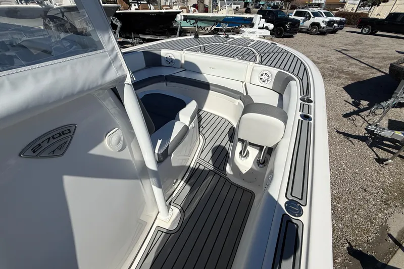 Slide: The Image of 2019 Tidewater 2700 Carolina Bay boat interior with seating and deck details. - 29
