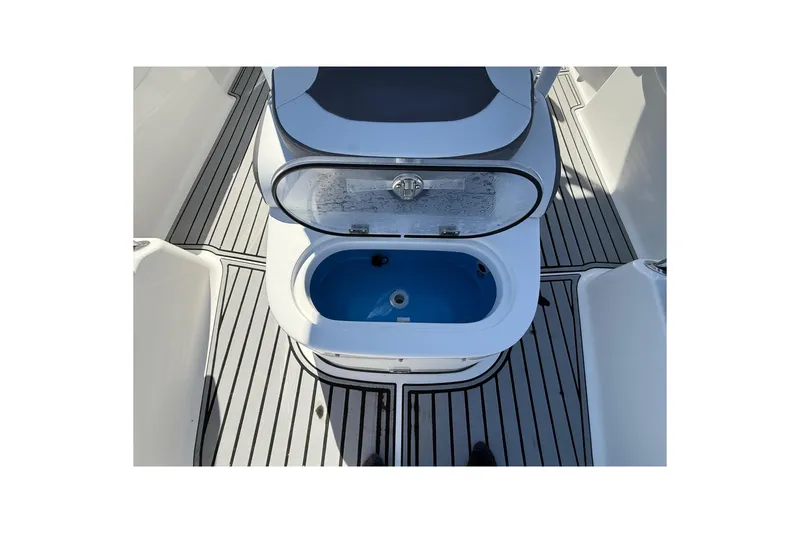 Slide: The Image of 2019 Tidewater 2700 Carolina Bay boat with open livewell on deck. - 33
