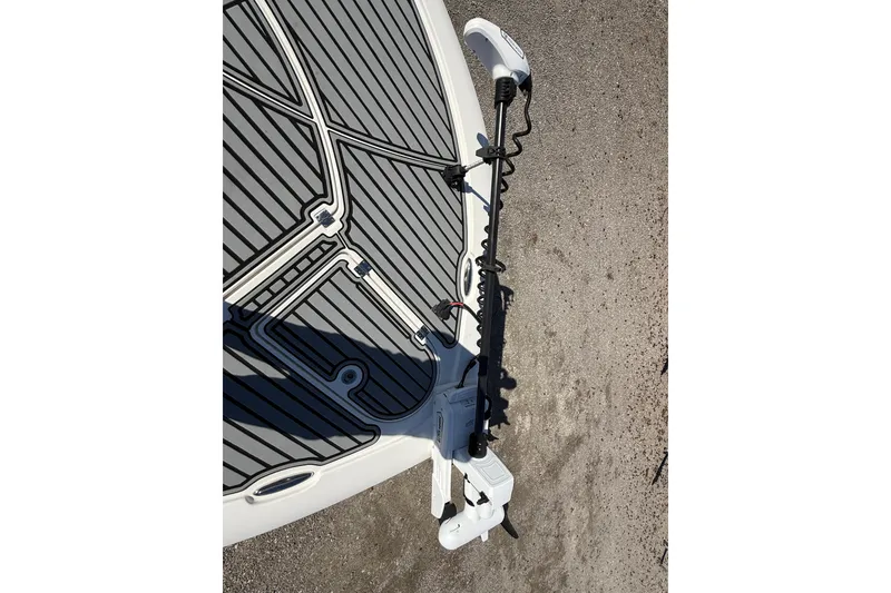 Slide: The Image of 2019 Tidewater 2700 Carolina Bay boat deck with trolling motor, featuring sleek design and detailing. - 34