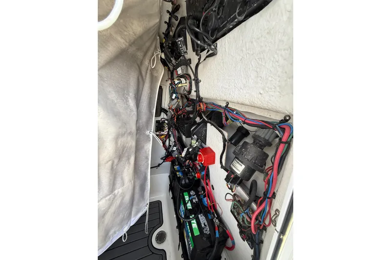 Slide: The Image of Electrical wiring and components inside a 2019 Tidewater 2700 Carolina Bay boat. - 37