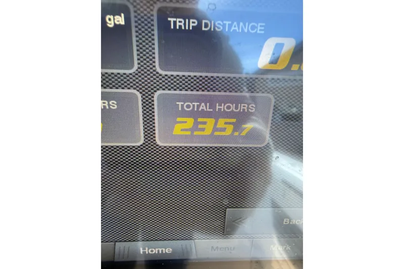Slide: The Image of Display screen showing 235.7 total hours on 2019 Tidewater 2700 Carolina Bay. - 38