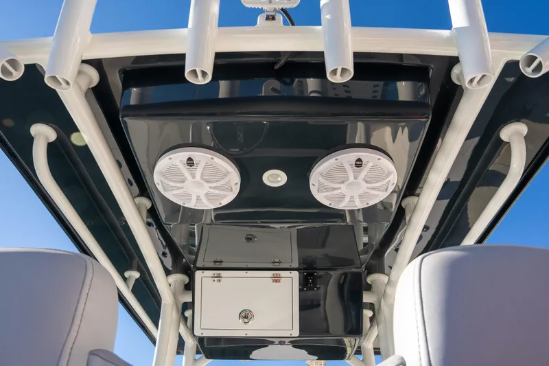 Slide: The Image of 2026 Bay Rider 239 Bay boat interior with speakers and storage compartments. - 11