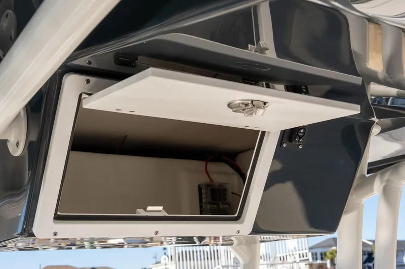 Slide: The Image of Open storage compartment on 2026 Bay Rider 239 Bay boat, showcasing interior details. - 13