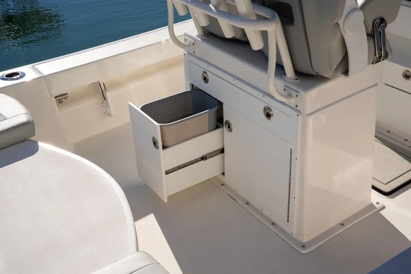 Slide: The Image of 2026 Bay Rider 239 Bay boat interior with storage compartment and seating. - 15