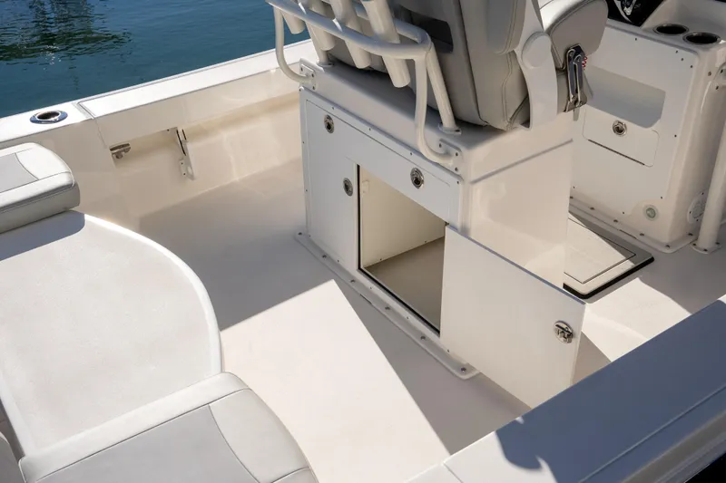 Slide: The Image of 2026 Bay Rider 239 Bay boat interior with open storage compartment and seating. - 17
