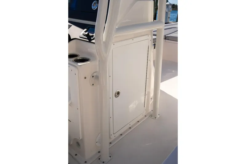 Slide: The Image of 2026 Bay Rider 239 Bay boat console with storage compartment and cup holders. - 20