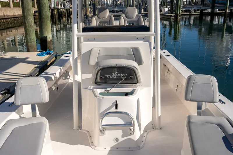 Slide: The Image of 2026 Bay Rider 239 Bay boat interior with seating and console at marina. - 23
