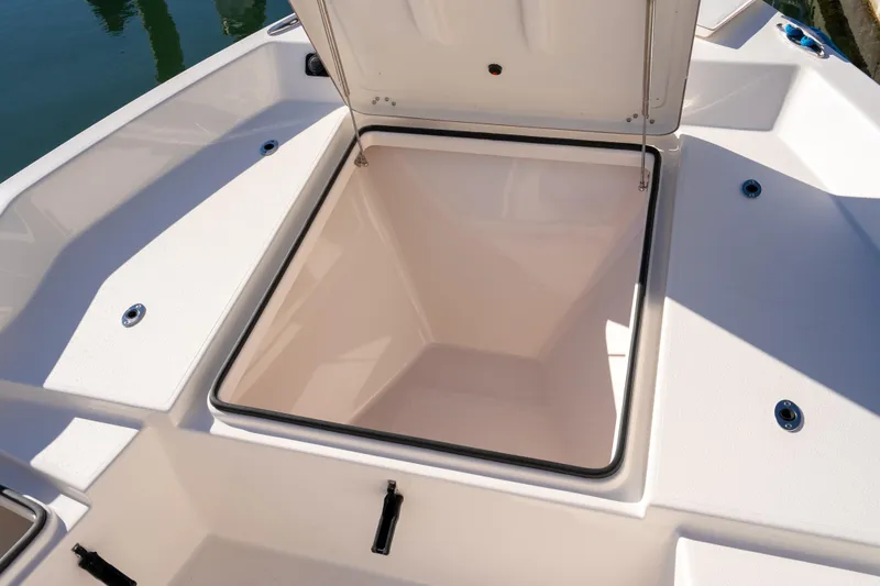 Slide: The Image of Open storage compartment on 2026 Bay Rider 239 Bay boat, showcasing spacious interior. - 29