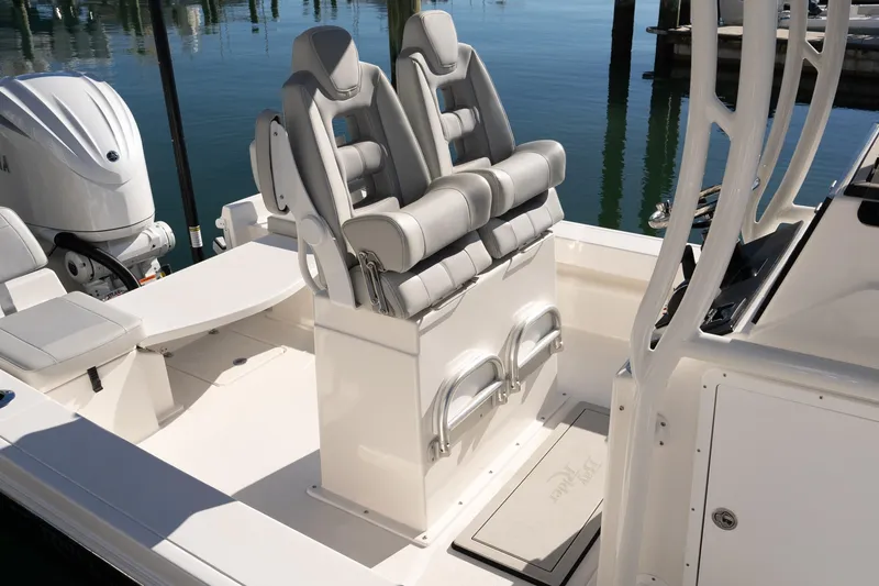 Slide: The Image of 2026 Bay Rider 239 Bay boat interior with dual seats and outboard motor. - 3
