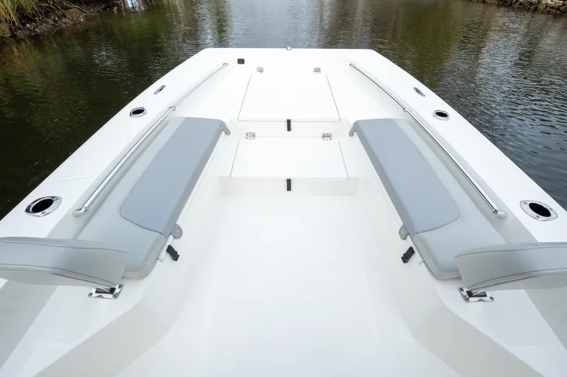 Slide: The Image of 2026 Bay Rider 2260 FS Skiff boat interior with seating and storage compartments. - 12