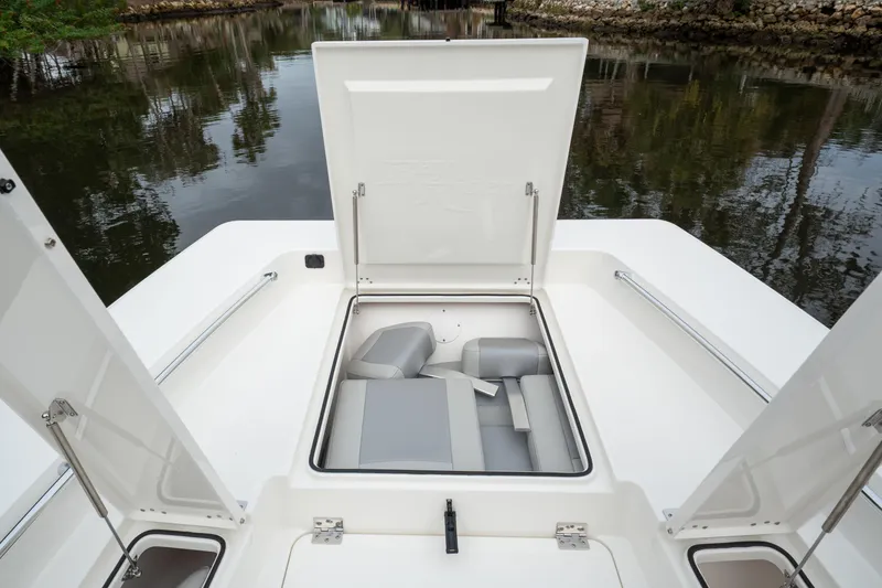 Slide: The Image of 2026 Bay Rider 2260 FS Skiff with open storage compartment, showcasing sleek design. - 18