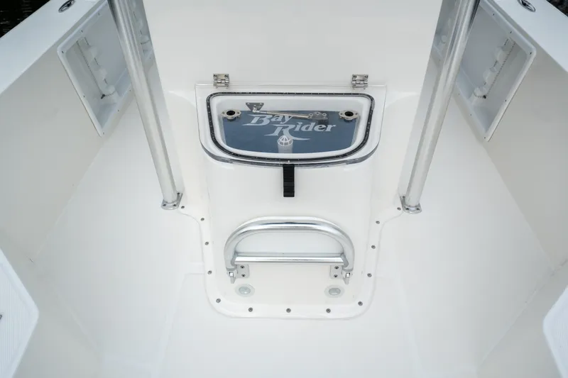 Slide: The Image of 2026 Bay Rider 2260 FS Skiff interior, featuring storage compartments and sleek design. - 20