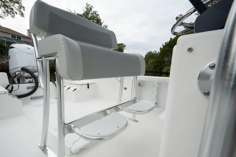 Slide: The Image of 2026 Bay Rider 2260 FS Skiff interior with seating and steering wheel, showcasing modern design. - 23