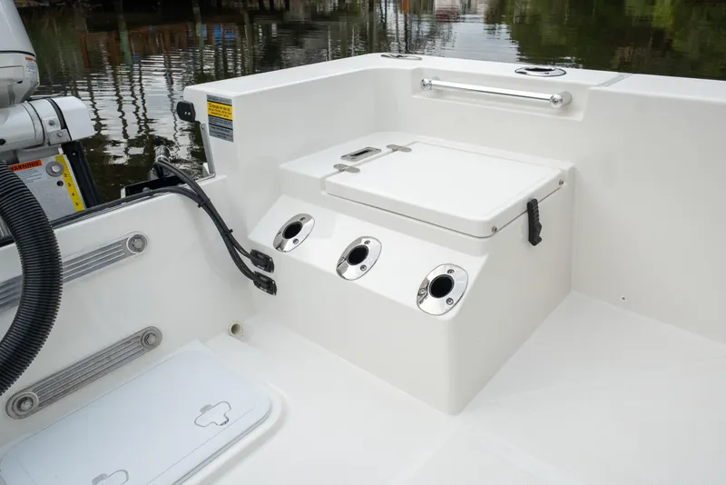Slide: The Image of 2026 Bay Rider 2260 FS Skiff interior with storage compartment and rod holders. - 26