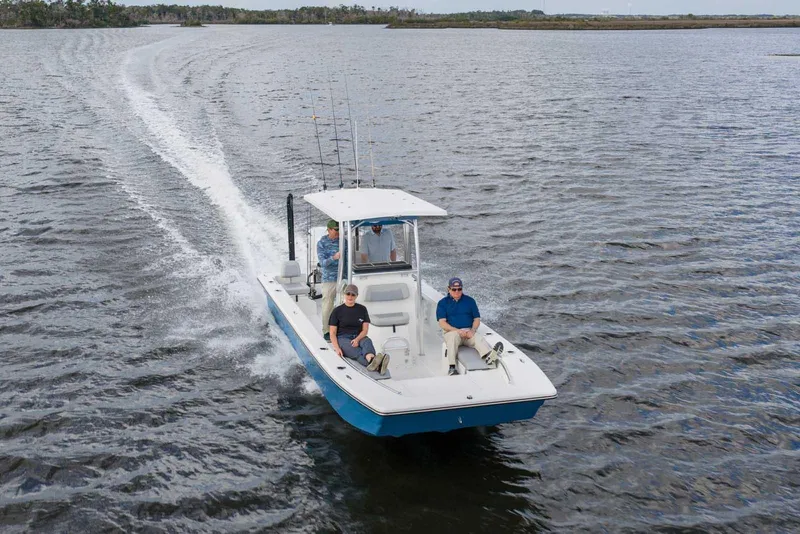 Slide: The Image of 2026 Bay Rider 2260 FS Skiff cruising on open water with passengers onboard. - 5