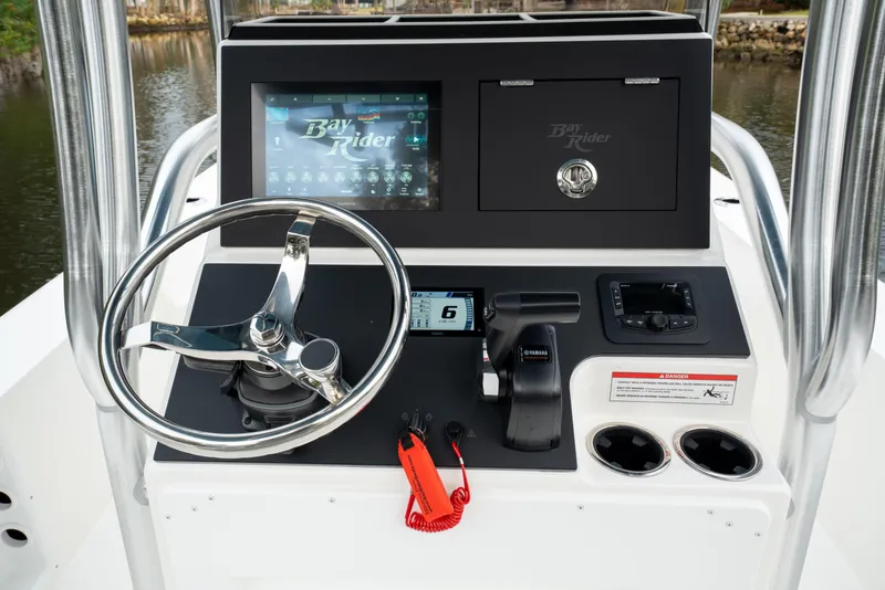 Slide: The Image of 2026 Bay Rider 2260 FS Skiff dashboard with steering wheel and control panel. - 7