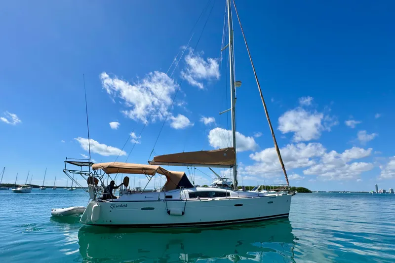 Slide: The Image of Sailing yacht Beneteau Oceanis 40, 2008 model, anchored in clear blue waters. - 1