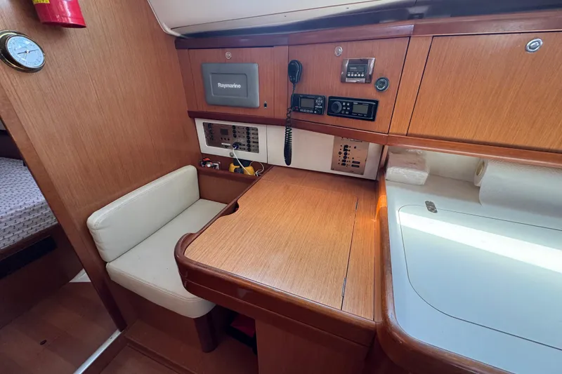 Slide: The Image of Interior of 2008 Beneteau Oceanis 40 yacht with navigation equipment and seating area. - 34