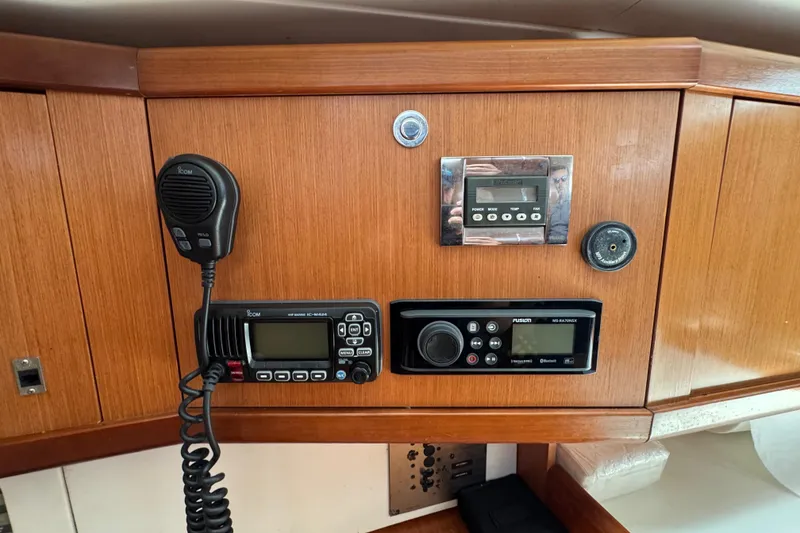 Slide: The Image of Control panel on a 2008 Beneteau Oceanis 40 yacht with radio and navigation equipment. - 35