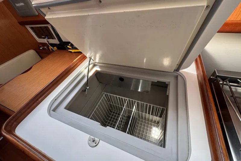 Slide: The Image of Open freezer compartment in 2008 Beneteau Oceanis 40 yacht kitchen interior. - 38