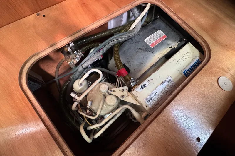 Slide: The Image of Engine compartment of a 2008 Beneteau Oceanis 40 sailboat, featuring mechanical components. - 47