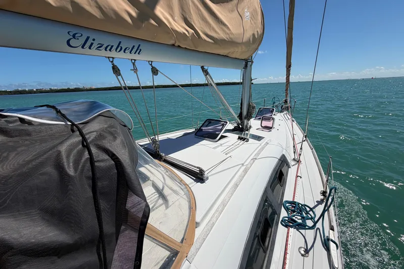 Slide: The Image of Sailing on a 2008 Beneteau Oceanis 40 yacht named Elizabeth in clear blue waters. - 52