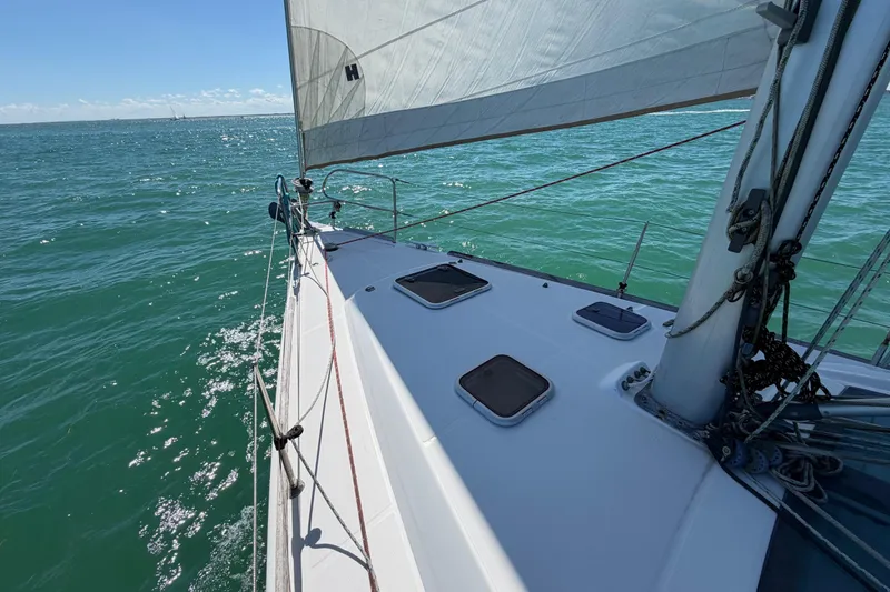 Slide: The Image of Sailing on a 2008 Beneteau Oceanis 40 yacht, gliding over clear blue waters. - 53