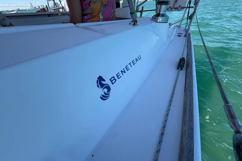 Slide: The Image of 2008 Beneteau Oceanis 40 sailboat on water, showcasing brand logo and deck details. - 54