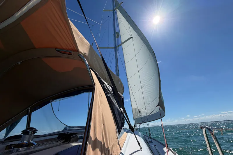 Slide: The Image of Sailing Beneteau Oceanis 40, 2008 model, under clear blue sky and bright sun. - 57