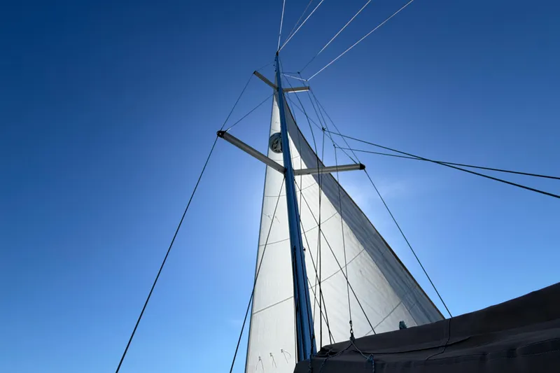 Slide: The Image of Sailboat mast and sail against clear blue sky, Beneteau Oceanis 40, 2008 model. - 59