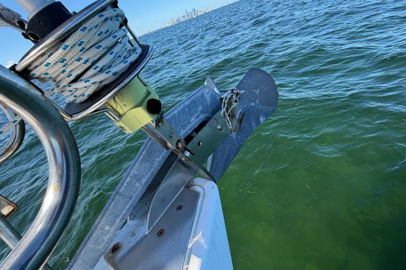 Slide: The Image of Bow of 2008 Beneteau Oceanis 40 sailboat with anchor over green water. - 67