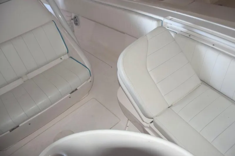 Slide: The Image of Raritan electric head, stainless steel sink with faucet, shower wand, and drained sole with SeaDek, mirror. - 13