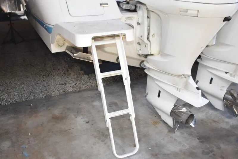 Slide: The Image of 2017 Intrepid 327 Open boat dashboard with steering wheel and navigation screens. - 4