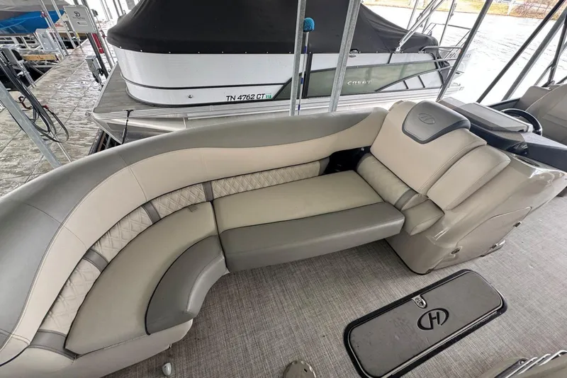 Slide: The Image of 2020 Harris Grand Mariner 250 boat interior with luxurious seating and elegant design. - 14