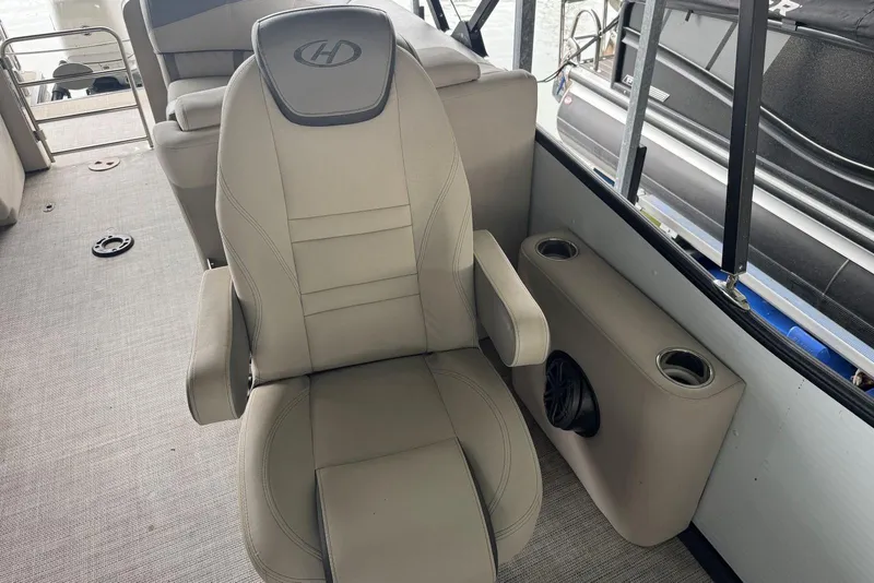 Slide: The Image of Luxurious seating on 2020 Harris Grand Mariner 250 pontoon boat with cup holders and speaker. - 16