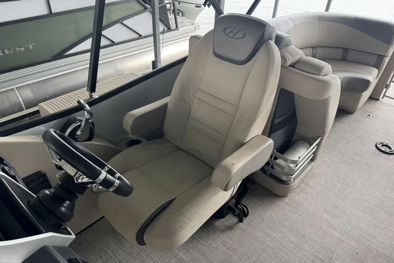Slide: The Image of Captain's chair and helm of 2020 Harris Grand Mariner 250 pontoon boat. - 17
