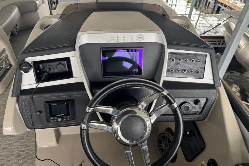 Slide: The Image of 2020 Harris Grand Mariner 250 dashboard with steering wheel and control panel. - 18