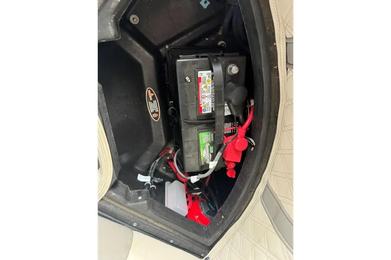 Slide: The Image of Battery compartment of a 2020 Harris Grand Mariner 250 boat, showing wiring and connections. - 30