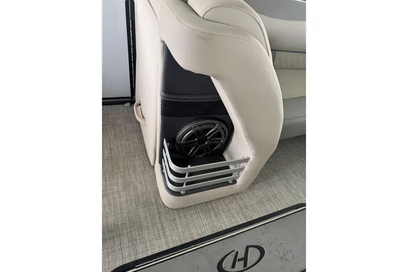 Slide: The Image of 2020 Harris Grand Mariner 250 boat interior with speaker and cushioned seating. - 33