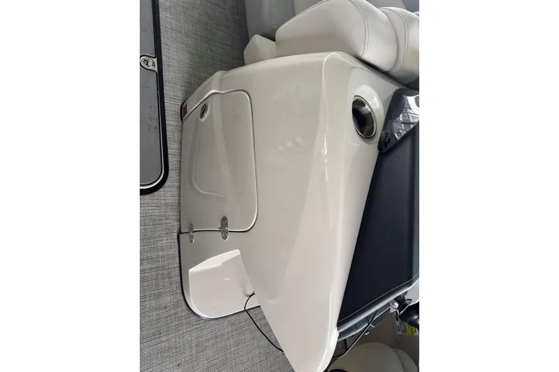 Slide: The Image of 2020 Harris Grand Mariner 250 boat interior with sleek white paneling and seating. - 35