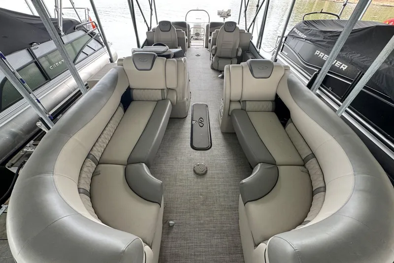 Slide: The Image of 2020 Harris Grand Mariner 250 pontoon boat interior with luxurious seating and spacious layout. - 9