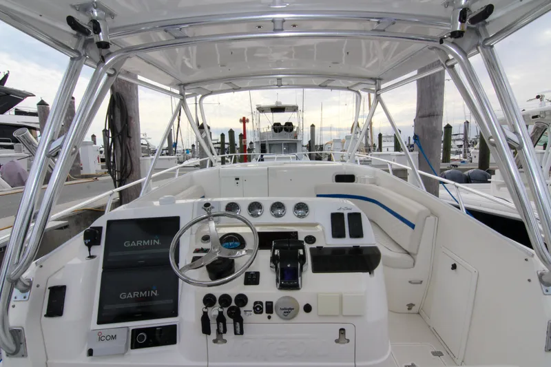 Slide: The Image of 2003 Intrepid 377 Walkaround boat cockpit with Garmin navigation system at marina. - 21