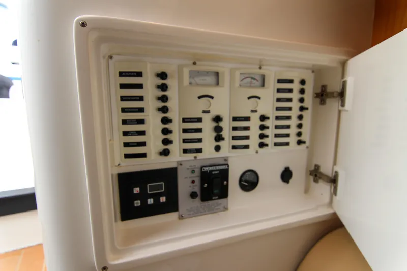 Slide: The Image of Electrical control panel inside a 2003 Intrepid 377 Walkaround boat. - 27