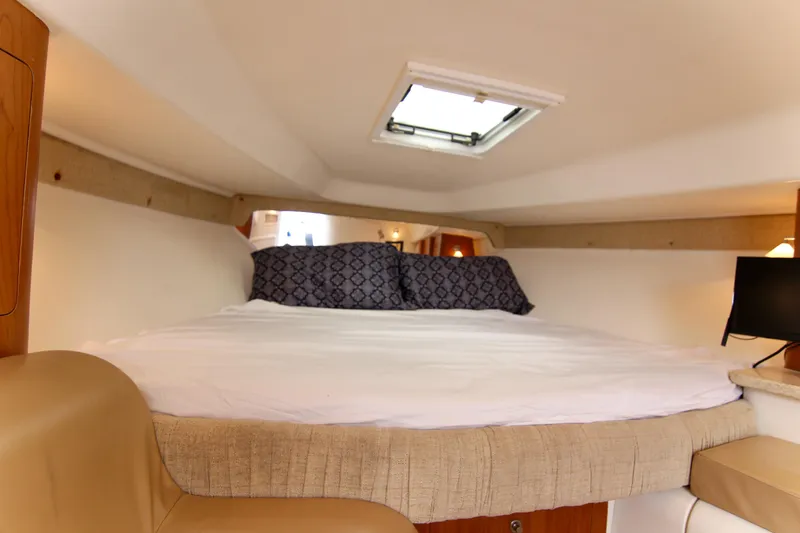 Slide: The Image of Cozy cabin interior of 2003 Intrepid 377 Walkaround with bed and skylight. - 28