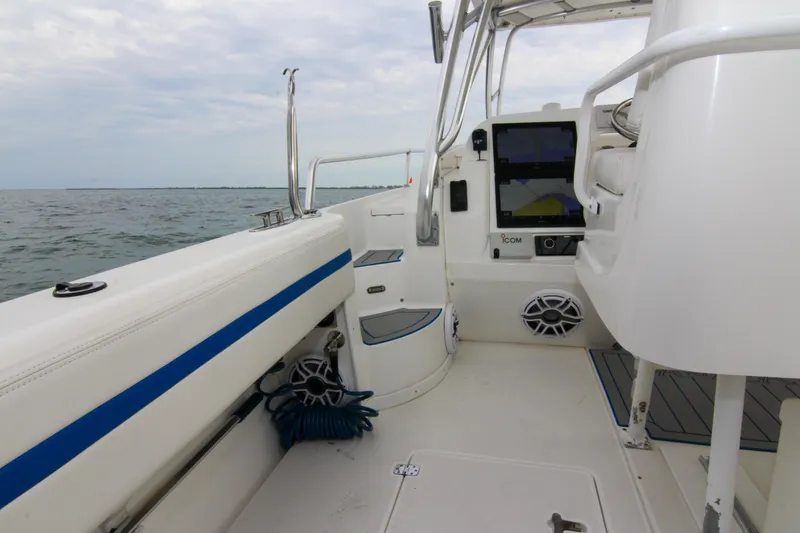 Slide: The Image of 2003 Intrepid 377 Walkaround boat interior with navigation equipment and ocean view. - 38