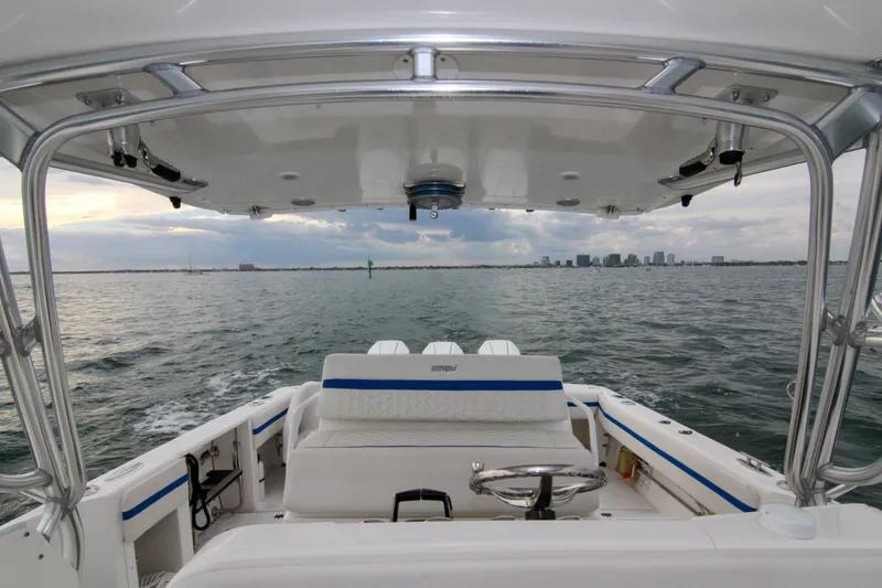 Slide: The Image of 2003 Intrepid 377 Walkaround boat interior with ocean view and city skyline. - 40
