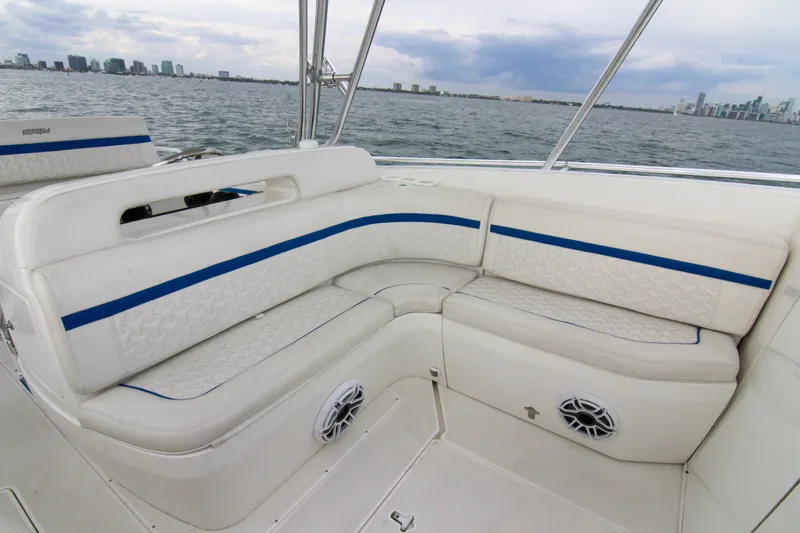 Slide: The Image of 2003 Intrepid 377 Walkaround boat with white seating and blue accents on open water. - 41